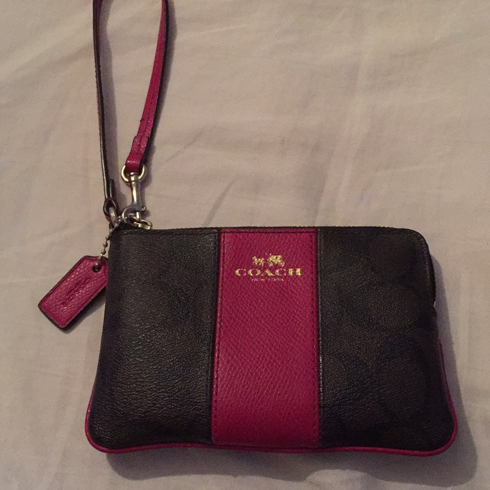 Coach raspberry colored wristlet.